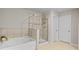Bright bathroom featuring tub, shower, tile flooring and modern finishes at 5584 Cannonade Ln, Stonecrest, GA 30058