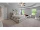 Serene main bedroom with a tray ceiling, neutral tones, a large bed, and ample natural light at 5584 Cannonade Ln, Stonecrest, GA 30058