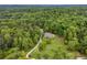 Expansive aerial view of a private home nestled among lush greenery and mature trees at 6125 Fouts Mill Rd, Douglasville, GA 30135