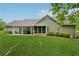 Expansive backyard featuring a patio, screened porch, and well-maintained lawn at 6125 Fouts Mill Rd, Douglasville, GA 30135