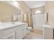 Clean bathroom features a white vanity, large mirror, and tiled shower/bath combination at 6125 Fouts Mill Rd, Douglasville, GA 30135