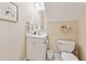Cozy bathroom with single vanity, framed mirror, and a seashell themed decor at 6125 Fouts Mill Rd, Douglasville, GA 30135
