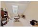 Bonus room with game table, natural light, and attic storage space at 6125 Fouts Mill Rd, Douglasville, GA 30135