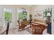 Comfortable dining room features wicker furniture, a bench, and plenty of natural light at 6125 Fouts Mill Rd, Douglasville, GA 30135