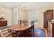 Elegant dining room featuring chandelier, hardwood floors, and classic furniture at 6125 Fouts Mill Rd, Douglasville, GA 30135
