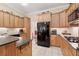 Well-equipped kitchen featuring granite counters, stainless appliances, and ample cabinet space at 6125 Fouts Mill Rd, Douglasville, GA 30135