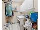 Functional laundry room with washer, dryer, and ample storage cabinets at 6125 Fouts Mill Rd, Douglasville, GA 30135