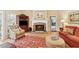 Cozy living room featuring stone fireplace, wood floors, and elegant furniture at 6125 Fouts Mill Rd, Douglasville, GA 30135