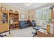 Office with desk area and a large window looking out into nature at 6125 Fouts Mill Rd, Douglasville, GA 30135