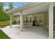 Charming outdoor patio with pergola, dining set, and views of the landscaped backyard at 6125 Fouts Mill Rd, Douglasville, GA 30135