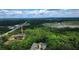 Scenic aerial view of treed neighborhood with highway and building in the distance on a partly cloudy day at 2167 Main Nw St, Atlanta, GA 30318
