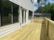 Exterior shot of the wooden backyard deck, an ideal spot for outdoor dining at 2167 Main Nw St, Atlanta, GA 30318