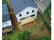 Aerial view of a home's backyard, showcasing a newly constructed wooden deck and ample green space at 2167 Main Nw St, Atlanta, GA 30318