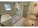 Bathroom showcasing dual sinks, soaking tub, and walk-in shower with modern fixtures at 2167 Main Nw St, Atlanta, GA 30318