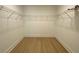 Walk-in closet featuring wire shelving and laminate floors at 2167 Main Nw St, Atlanta, GA 30318