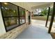 Inviting front porch features dark wood columns, brick accents, and a stylish front door at 2167 Main Nw St, Atlanta, GA 30318