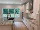 Modern kitchen with white cabinets, stainless appliances, and large island with bar seating at 2167 Main Nw St, Atlanta, GA 30318