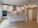 Stylish kitchen with white cabinets, stainless appliances, granite countertops, and pendant lighting at 2167 Main Nw St, Atlanta, GA 30318