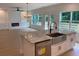 Modern kitchen island features stainless steel sink, dishwasher, and marble countertops at 2167 Main Nw St, Atlanta, GA 30318