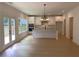 Open-concept kitchen featuring stainless appliances, granite countertops, and access to the patio at 2167 Main Nw St, Atlanta, GA 30318