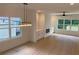 Open-concept living room featuring wood floors, modern fireplace, built-in cabinets, and plenty of natural light at 2167 Main Nw St, Atlanta, GA 30318