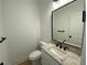 The powder room features elegant fixtures and a modern vanity at 2167 Main Nw St, Atlanta, GA 30318
