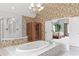 A luxurious bathroom with a soaking tub, glass shower, and sauna; wallpaper is decorated with scenes of arches at 6355 Stallion Dr, Cumming, GA 30040