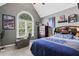 Cozy bedroom with vaulted ceiling, a large window, comfortable recliner and gray walls at 6355 Stallion Dr, Cumming, GA 30040