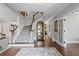 Grand foyer showcasing hardwood floors, a staircase, and elegant decor at 6355 Stallion Dr, Cumming, GA 30040
