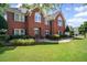 Beautiful brick home features a lush lawn and mature trees at 6355 Stallion Dr, Cumming, GA 30040
