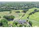 Scenic aerial view of the Polo Golf and Country Club golf course, clubhouse, ponds, and lush green fairways at 6355 Stallion Dr, Cumming, GA 30040