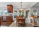 Kitchen nook featuring a wood table, seating for six, and lots of light at 6355 Stallion Dr, Cumming, GA 30040