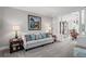Cozy living room with neutral tones, plush carpet, and elegant furnishings at 6355 Stallion Dr, Cumming, GA 30040