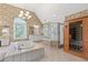 Luxurious main bathroom with a jetted tub, separate shower, and dual vanities at 6355 Stallion Dr, Cumming, GA 30040