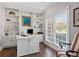 Bright home office with custom built-ins, hardwood floors, and ample storage at 6355 Stallion Dr, Cumming, GA 30040