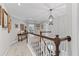 Upstairs hallway boasting elegant trim work and natural light from the stairwell at 6355 Stallion Dr, Cumming, GA 30040