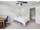 Clean bedroom featuring neutral colored carpet, natural light and ceiling fan at 6720 Wolford Ct, Johns Creek, GA 30097