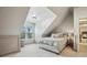 Bright bedroom with natural light, chair railing, and a view of another bedroom at 6720 Wolford Ct, Johns Creek, GA 30097