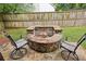 Stone firepit and outdoor seating area in the backyard at 6720 Wolford Ct, Johns Creek, GA 30097