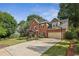 Charming two-story brick home with well-manicured lawn at 6720 Wolford Ct, Johns Creek, GA 30097
