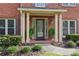 Welcoming front porch with decorative plants and elegant pillars, providing a cozy entrance at 6720 Wolford Ct, Johns Creek, GA 30097