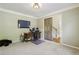 Spacious office featuring a sliding barn door and a large television, perfect for working from home at 6720 Wolford Ct, Johns Creek, GA 30097