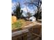 Backyard view from wooden deck showing the detached garage, wooden fence and lush green grass at 1740 Langston Sw Ave, Atlanta, GA 30310