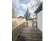 Large backyard with wood fence and lush green grass with detached garage and blue trash cans at 1740 Langston Sw Ave, Atlanta, GA 30310