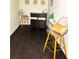 Inviting bar area with stools and dark wood floors, perfect for entertaining guests and enjoying casual drinks at 1740 Langston Sw Ave, Atlanta, GA 30310