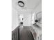 Bright hallway with hardwood floors, fresh paint, and decorative accents create an inviting space at 1740 Langston Sw Ave, Atlanta, GA 30310