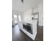 Clean, bright kitchen with white cabinets, a large island with microwave, and stainless steel appliances at 1740 Langston Sw Ave, Atlanta, GA 30310
