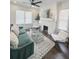 Bright living room featuring a fireplace, modern decor and ample natural light through large windows at 1740 Langston Sw Ave, Atlanta, GA 30310