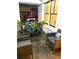 Relaxing patio with comfortable seating, perfect for enjoying the outdoors with plants and natural light at 1740 Langston Sw Ave, Atlanta, GA 30310