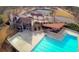 Aerial view of the community pool, tennis courts, and clubhouse, showcasing the upscale recreational amenities available at 3527 Starwood Sw Trl, Lilburn, GA 30047